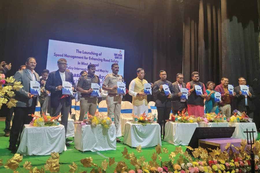 State transport minister Snehasish Chakrabarty releases the road safety report in the presence of senior state and central officials