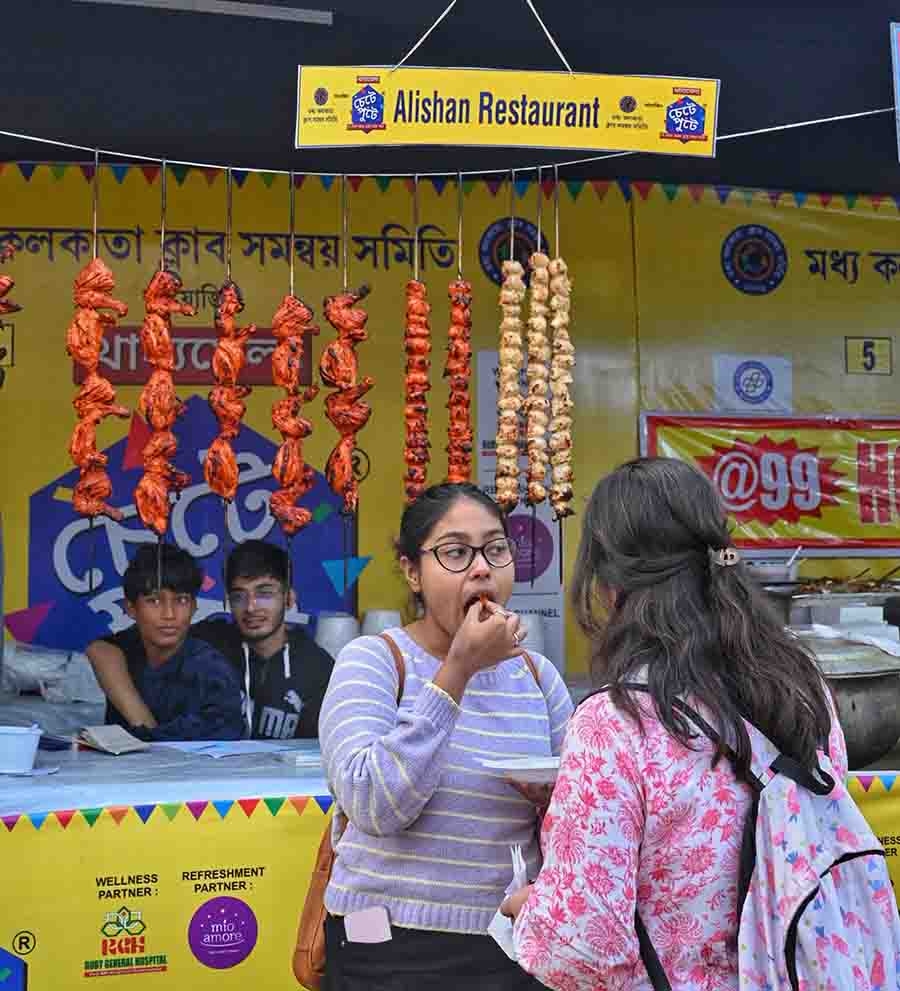 Youngsters tuck in kebabs at Chetey Putey food festival at Santosh Mitra Square near Sealdah on Thursday. The fest will continue till January 14  