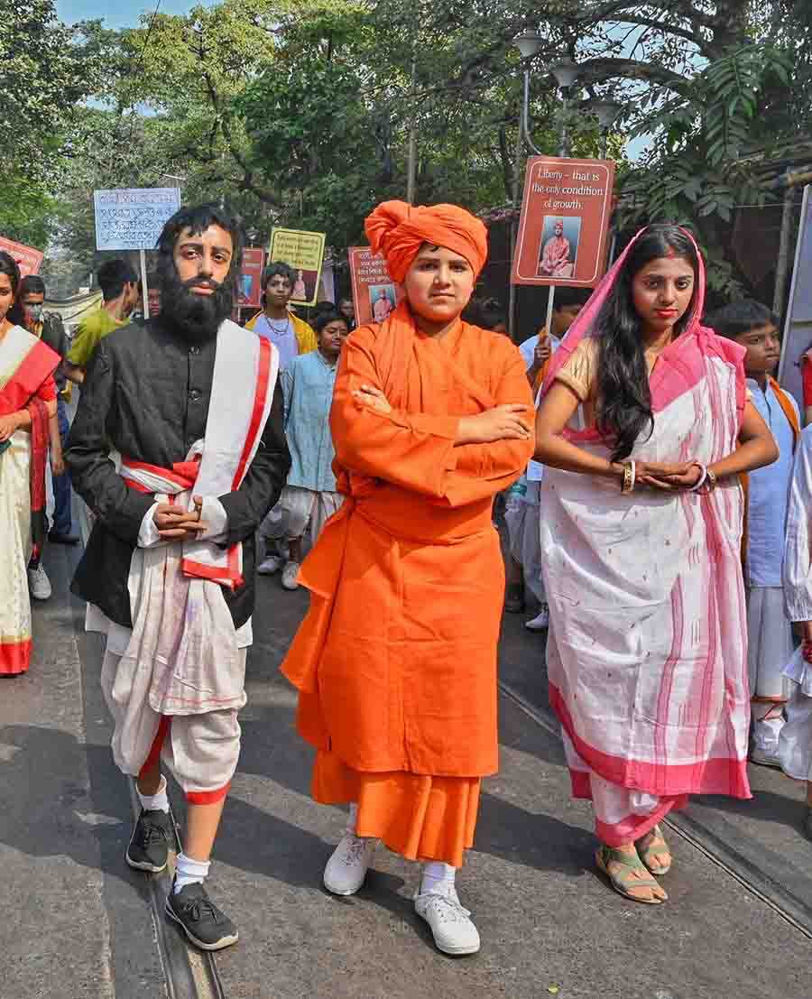 Students dressed as Ramakrishna Paramhansa, Swami Vivekananda and Sarada Devi walk in a procession brought out from Ramakrishna Mission Swami Vivekananda’s Ancestral House and Cultural Centre in north Kolkata