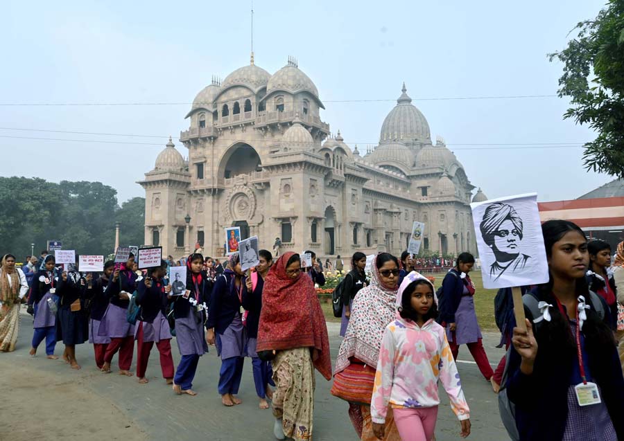 People from various age groups accompany the procession at Belur Math