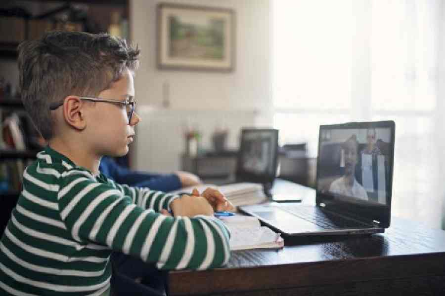 Boy attending online class from home