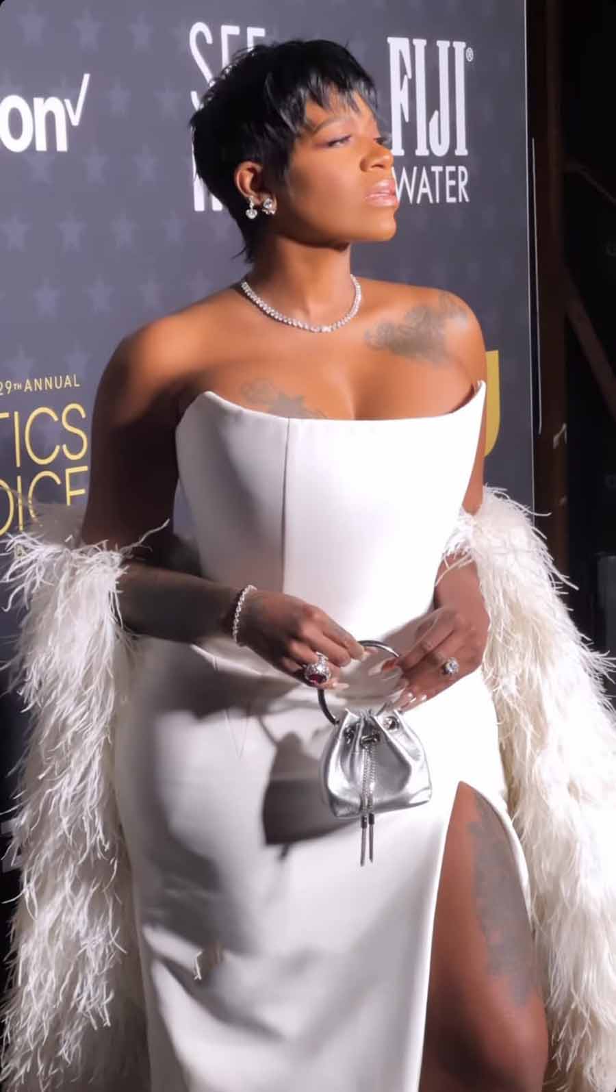 The Colour Purple actress Fantasia Taylor looked gorgeous in a white hobble corset with a thigh-high slit, paired with silver accessories and a matching stole.  