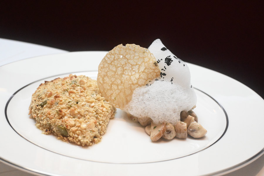 The Hazelnut Crusted Chicken is made using molecular gastronomy techniques. The chicken flesh is transformed into a velvety and light mousse, coated with finely chopped hazelnuts and cooked to a golden hue. Throw in some buttery sauteed mushrooms, a Pommery mustard emulsion and a subtle infusion of truffle air