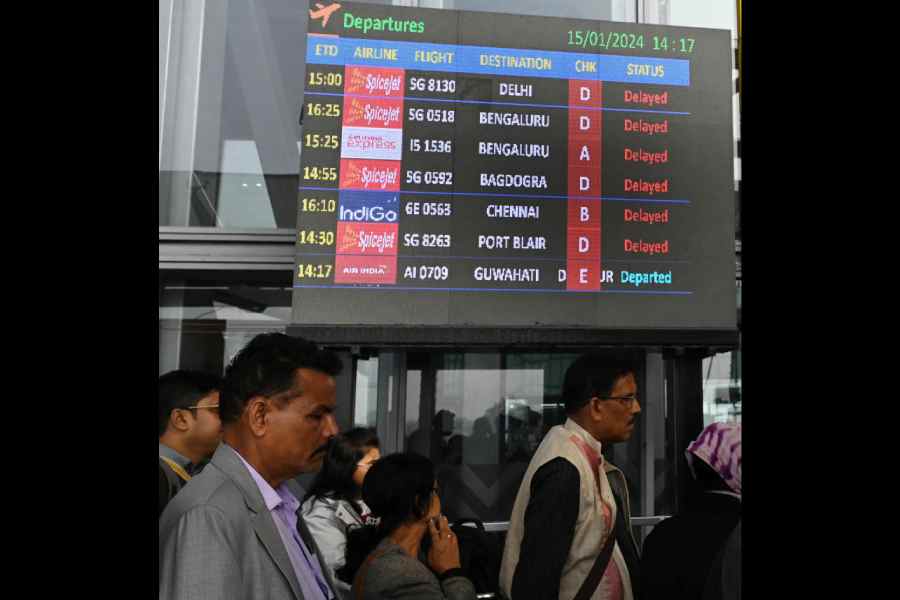 An airport screen mentions a host of delayed flights on Monday. Picture by Pradip Sanyal