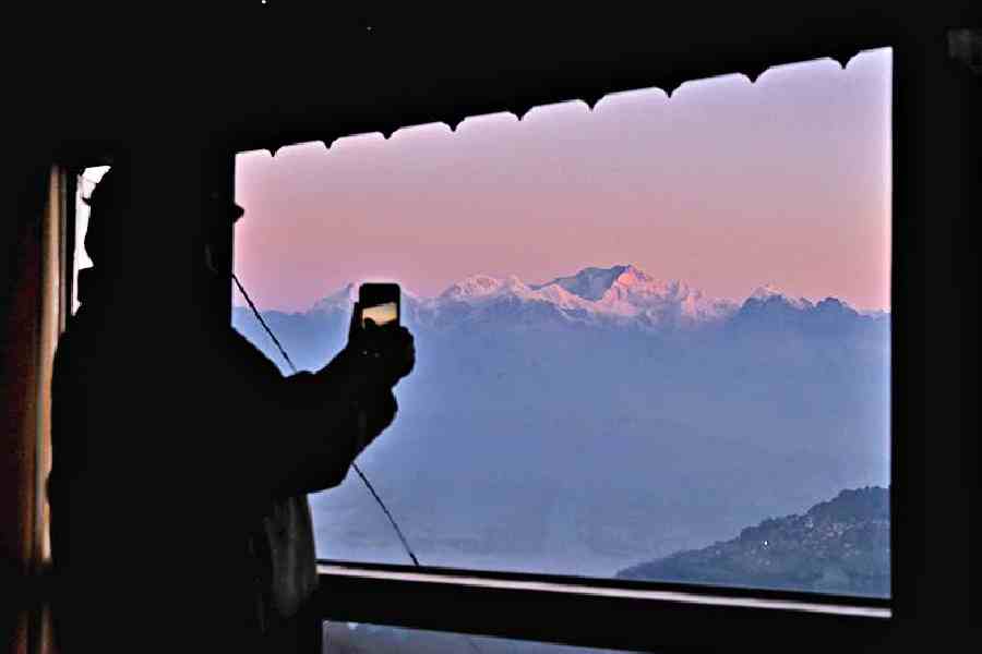 Capture the breathtaking view of the golden and snowcapped peaks of the magnificent Kanchenjunga at sunrise, right from your room