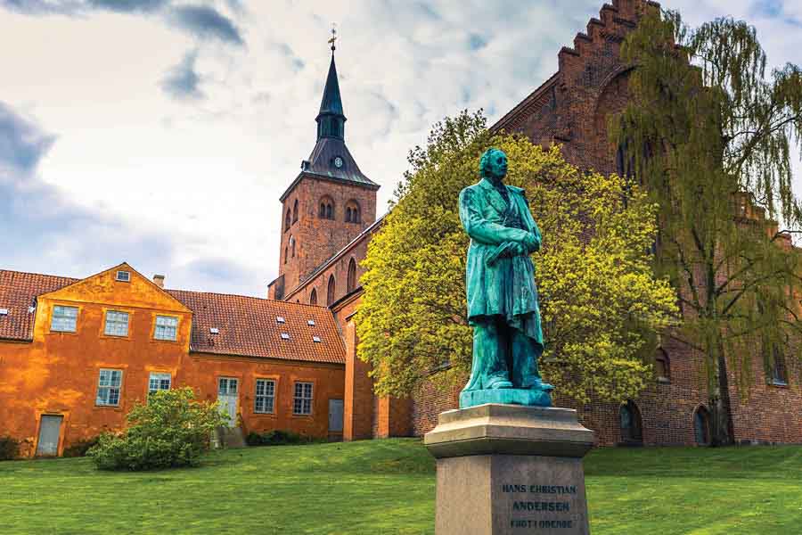 Cathedral of Saint Canute and Statue of Hans C Andersen in Odense, Denmark