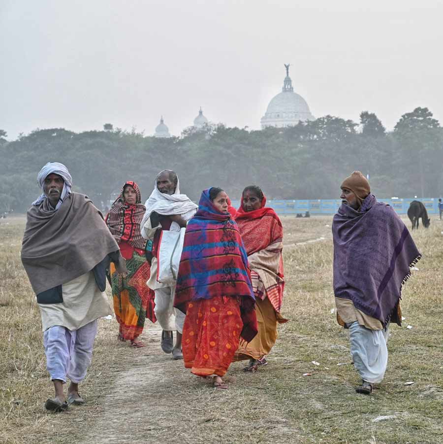 Gangasagar pilgrims at Maidan ‘armoured’ in warm clothes on a foggy Tuesday morning. The minimum temperature was recorded at 13.6˚C  