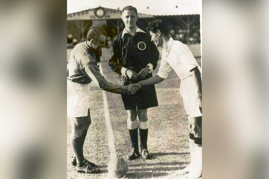 French caption Gabriel Robert and (right) Talimeren Ao shake hands during the 1948 match 