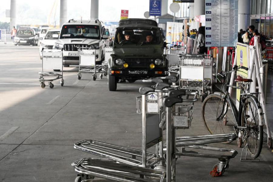 Trolleys lie scattered in front of the airport terminalon the arrival level on Monday
