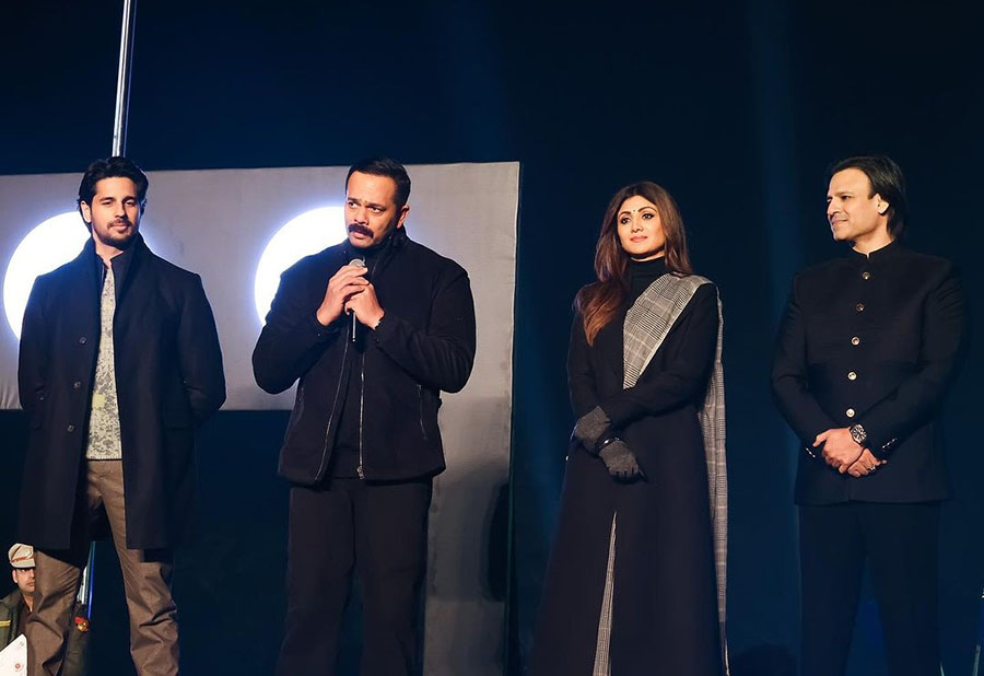 Sidharth, Shilpa and Vivek joined Rohit on stage as he spoke into a microphone about his upcoming project.  