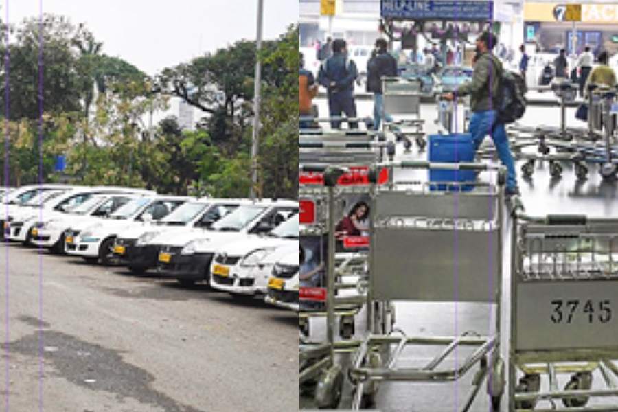 ﻿Cars parked opposite the old domestic terminal of the Kolkata airport on Thursday. Touts illegally park their vehicles here. (Right) Trolleys lie scattered outside the building, at the arrival level, on Thursday.
