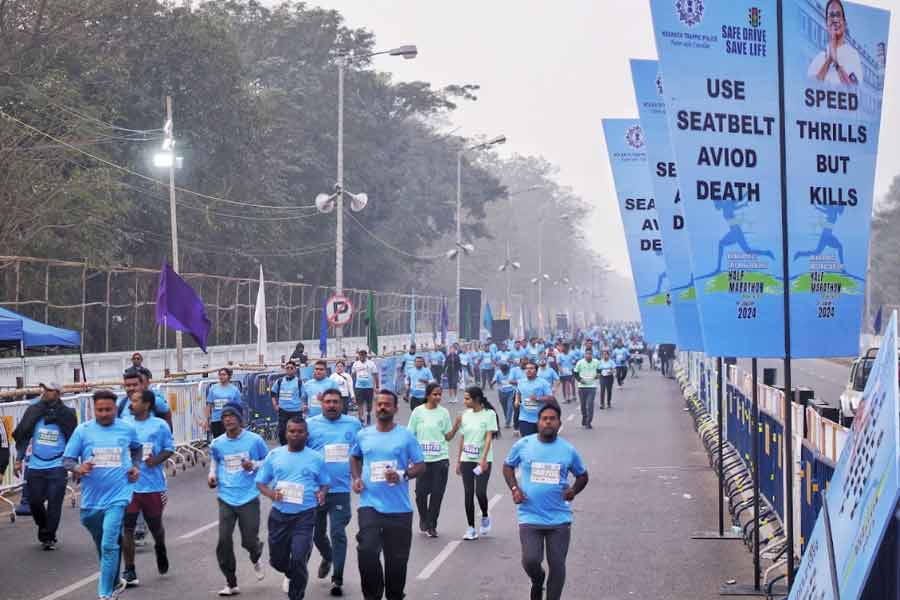 Kolkata Police and Kolkata Traffic Police personnel kept watch as marathoners completed the different stretches