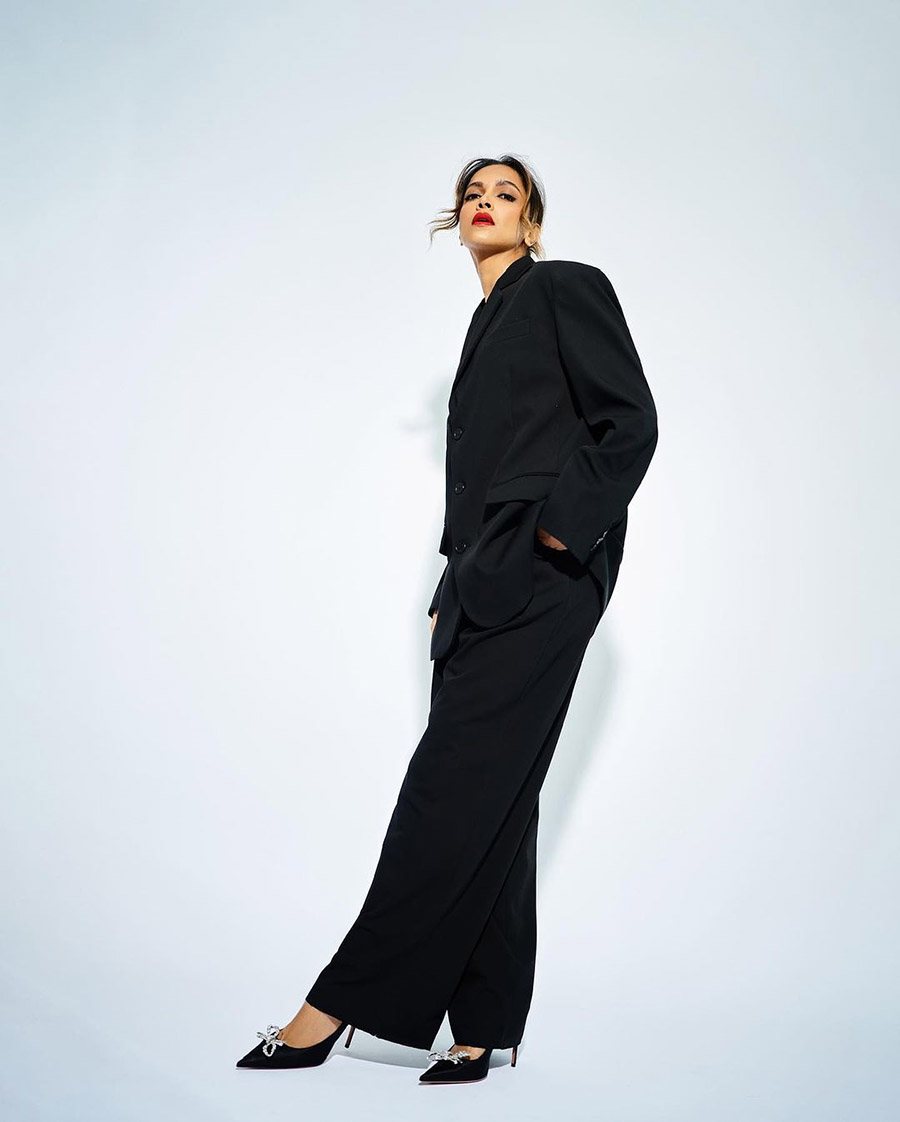 The Pathaan actress paired her blazer with coordinating trousers and pointed toe stilettos featuring a bejewelled bow at the front.  