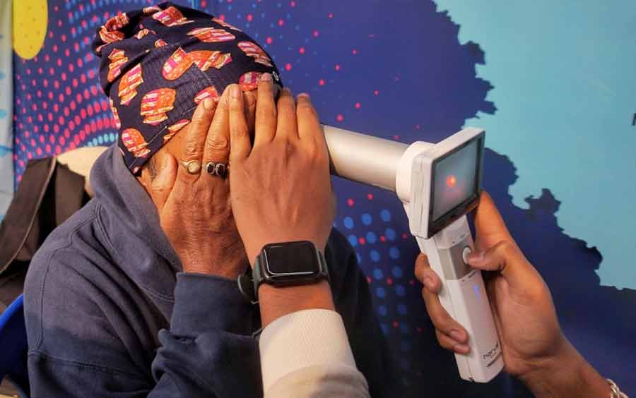 Visitors at the 47th International Kolkata Book Fair take AI influenced Diabetic Retinopathy Screening. This initiative is undertaken by Disha Eye Hospitals to address the growing concern of diabetes-related eye complications and the need for early detection for effective management  
