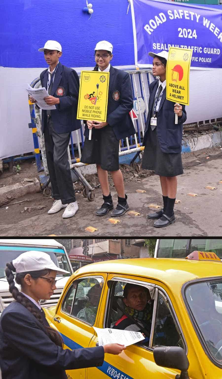 Students with placards of traffic safety spread awareness at the junction of Moulali crossing  