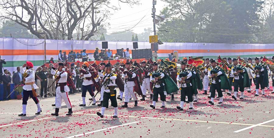 Bagpipers of the Indian Army march past the podium