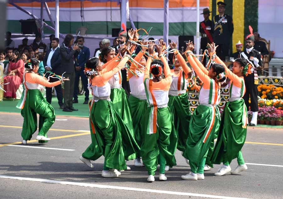 Schoolgirls clad in Tricolour clothes perform on Red Road