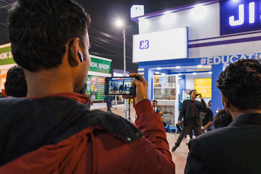 Apart from scouting the fair for books, visitors stop by to enjoy some music and capture it on their phones 