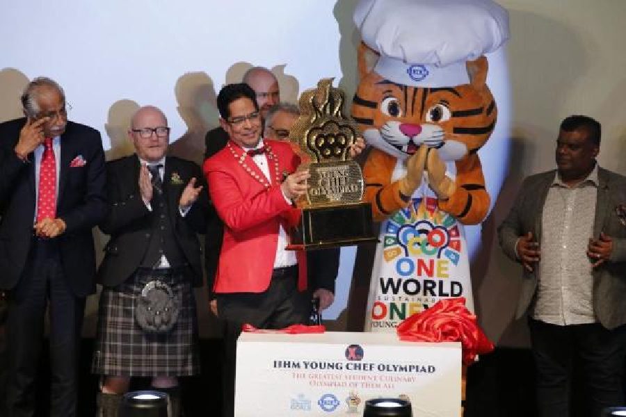 Suborno Bose, chief mentor and chairman, International Institute of Hotel Management, and CEO, International Hospitality Council, unveils the Young Chef Olympiad trophy on Monday