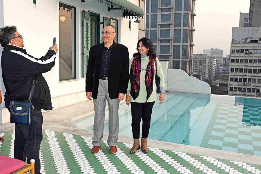 Filmmaker Aniruddha Roy Chowdhury clicks friends Rupnath Roy Chowdhury, industrialist, and wife Jita at the Glenburn Penthouse infinity swimming pool