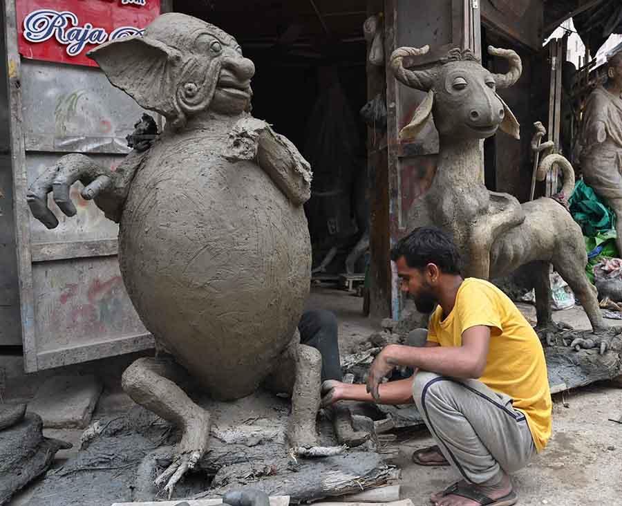 An artisan prepares life-size replicas of fictional characters from Sukumar Roy’s ‘Abol Tabol’ at Kumartuli on Wednesday