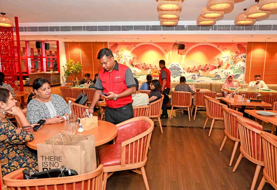 The revamped space has a contemporary vibe with traditional accents. Keeping the signature Haka theme colour of red, the space has modern wood panelling and indoor plants with wall art featuring Chinese dragons, and more 