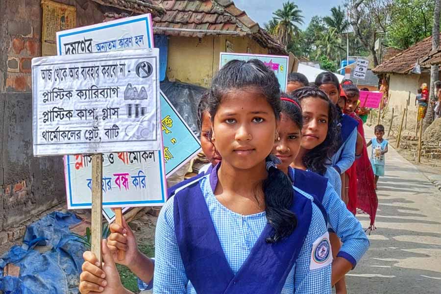 Schoolgirls take part in a march against use of polythene carry bags, thermocol and other items at Ghoramara Island in the Sunderbans   