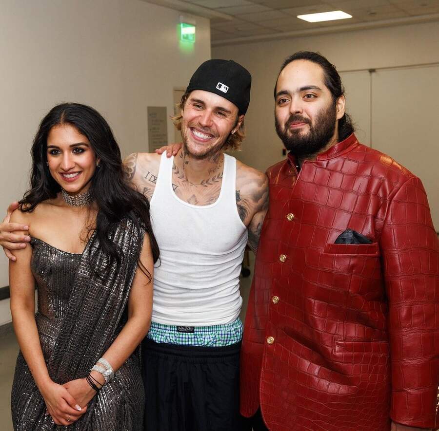 The Peaches singer sported a white vest, black baseball cap and low-waist shorts for his performance at the event that took place in Mumbai. He posed with Anant and Radhika after the ceremony. For the sangeet, Radhika looked stunning in a metallic corset-fit sari ensemble, while Anant sported a brown leather bandhgala.