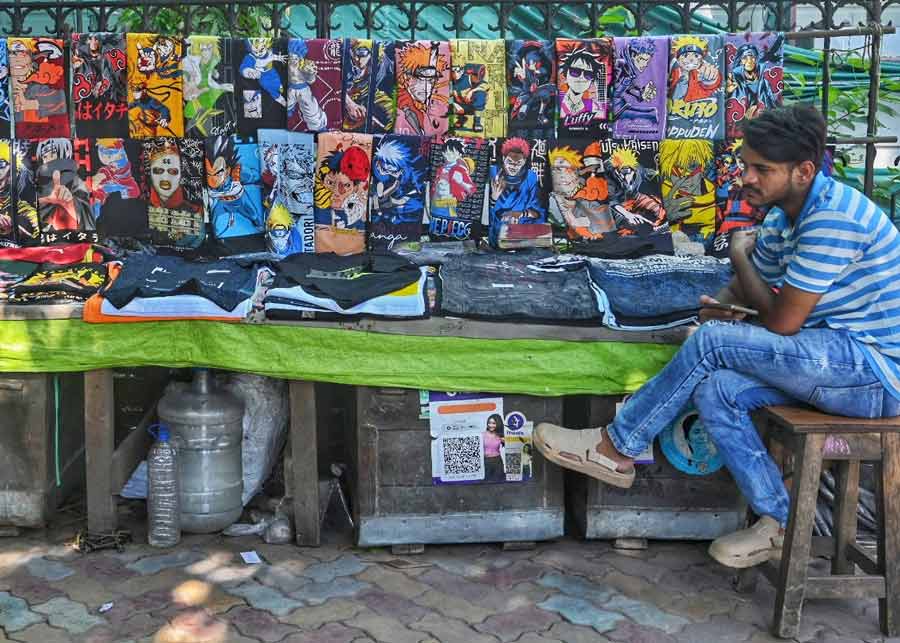 An anime T-shirt seller waits for customers at Park Street on Wednesday afternoon