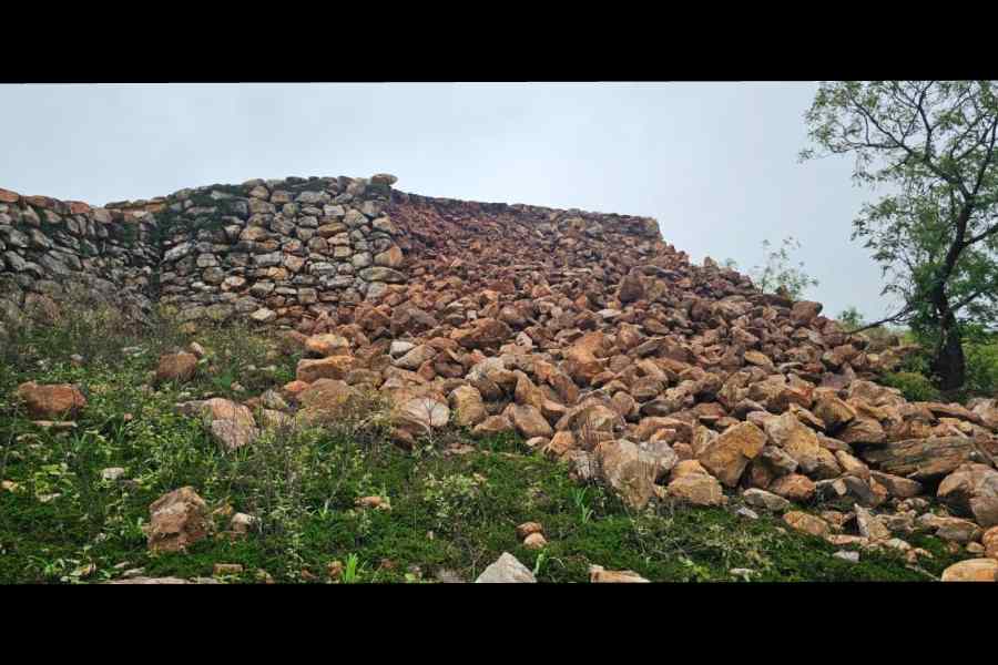 A collapsed portion of the Cyclopean Wall after rain in Rajgir