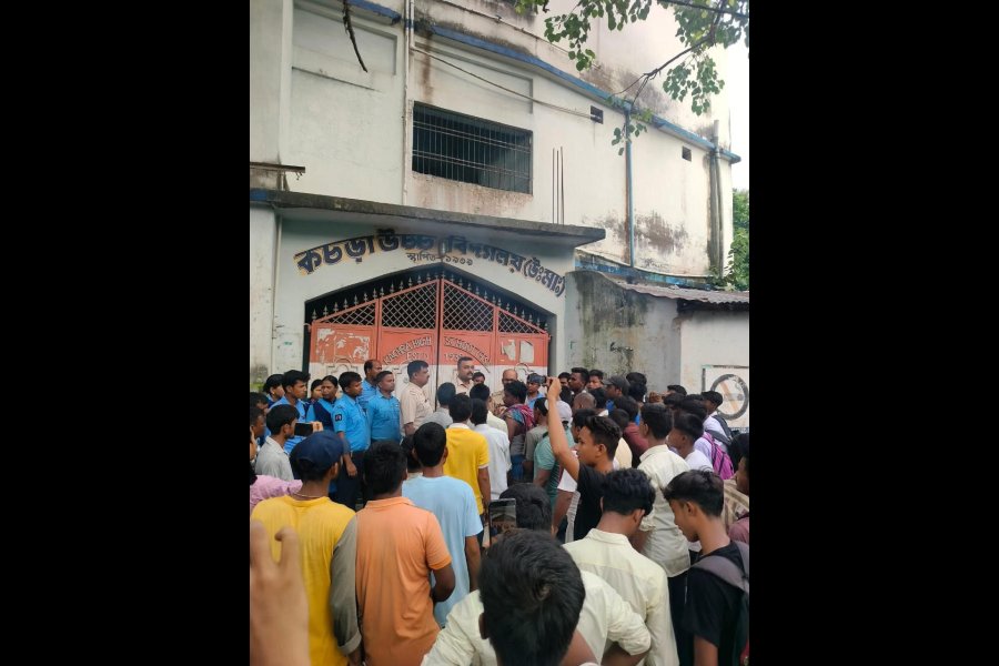 Villagers demonstrate in front of the Kachra High School on Wednesday.