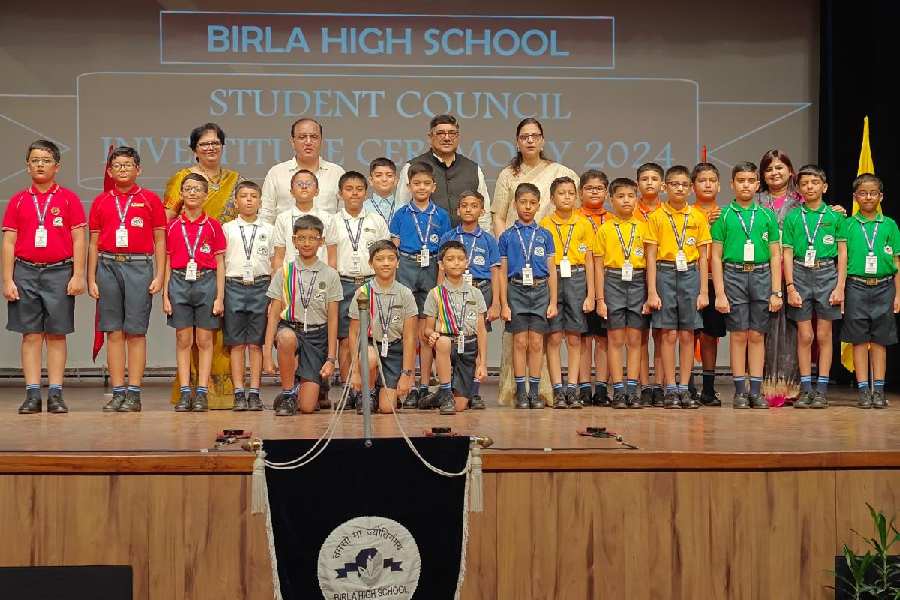 The junior leaders of the student council of Birla High School take a group picture with principal Loveleen Saigal, VN Chaturvedi, Tapas Bera and Farida Singh