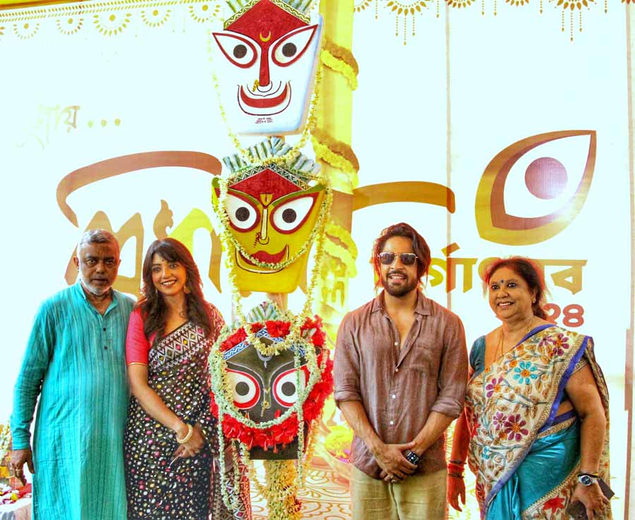 Actors Gourab Chatterjee and Devlina Kumar with Debasish Kumar and Debjani Kumar at the Khunti Puja of Tridhara Sammilani on Monday