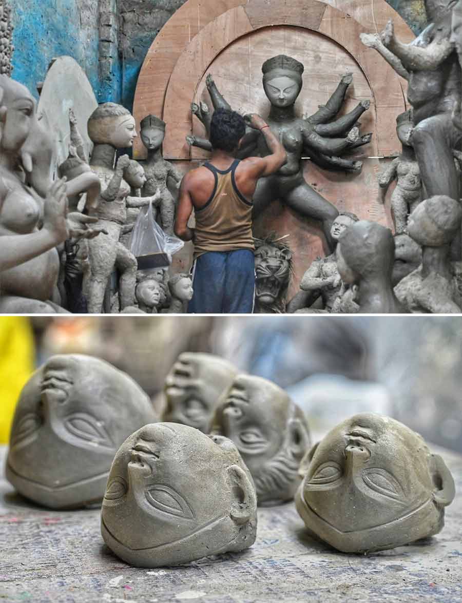 An artist works on a Durga idol at Kumartuli on Tuesday