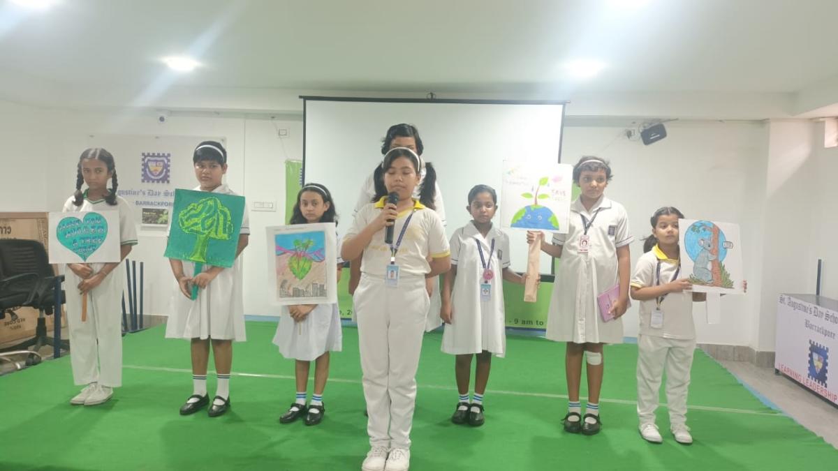 Students stage a skit on how one must plant more trees and save the planet