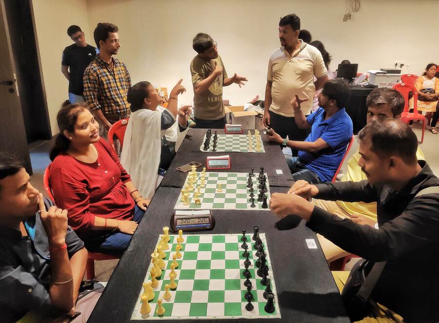 Paromita Ghosh (in red) is a national-level chess player with a hearing impairment. We spoke to her with help from her coach Niloy Chakraborty, acting as the interpreter. Paromita, a mother and homemaker, has been playing chess for over 15 years. She praised the competition at KCC as well-organised and a great initiative — providing an opportunity to play against strong competitors. Paromita is a bronze medalist at the national level and competes in tournaments whenever she can, supported by Niloy 