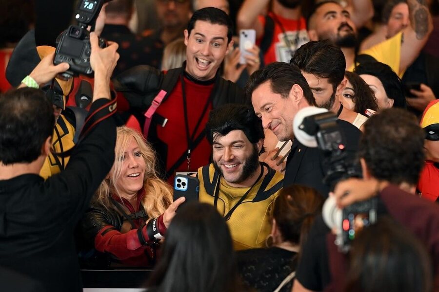 Fans dressed as Deadpool and Wolverine took selfies with Jackman at the premiere.
