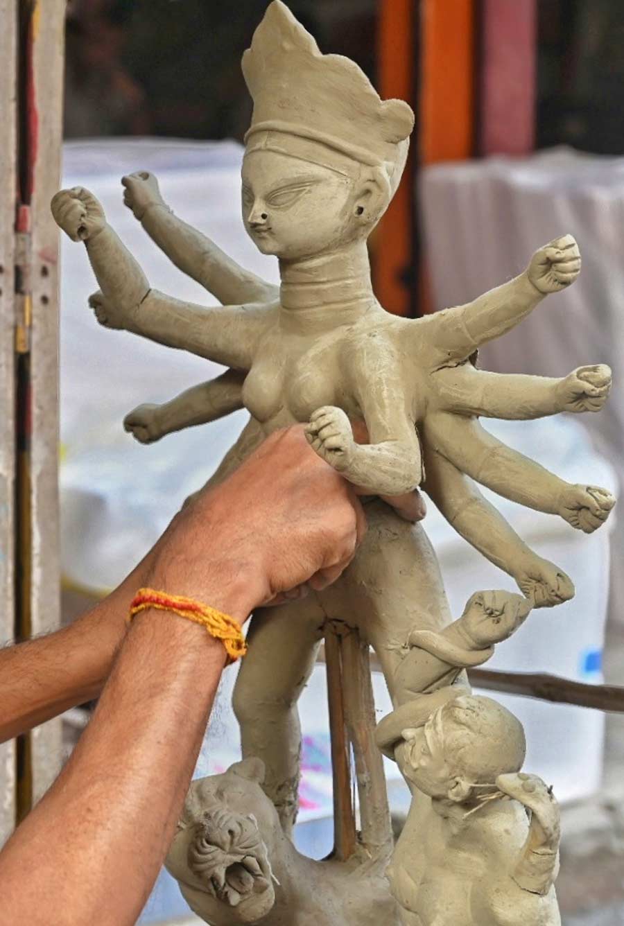 An artist lends shape to a small Durga idol at Kumartuli. Only 73 days are left for Durga Puja  