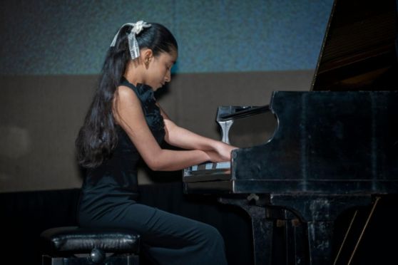 The youngest speaker, Palak Chauhan, captivated the audience with her piano recital and mastery of music.