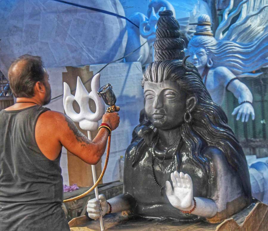 An artist paints a prop at Dompara ahead of Durga Puja, which is 70 days away  