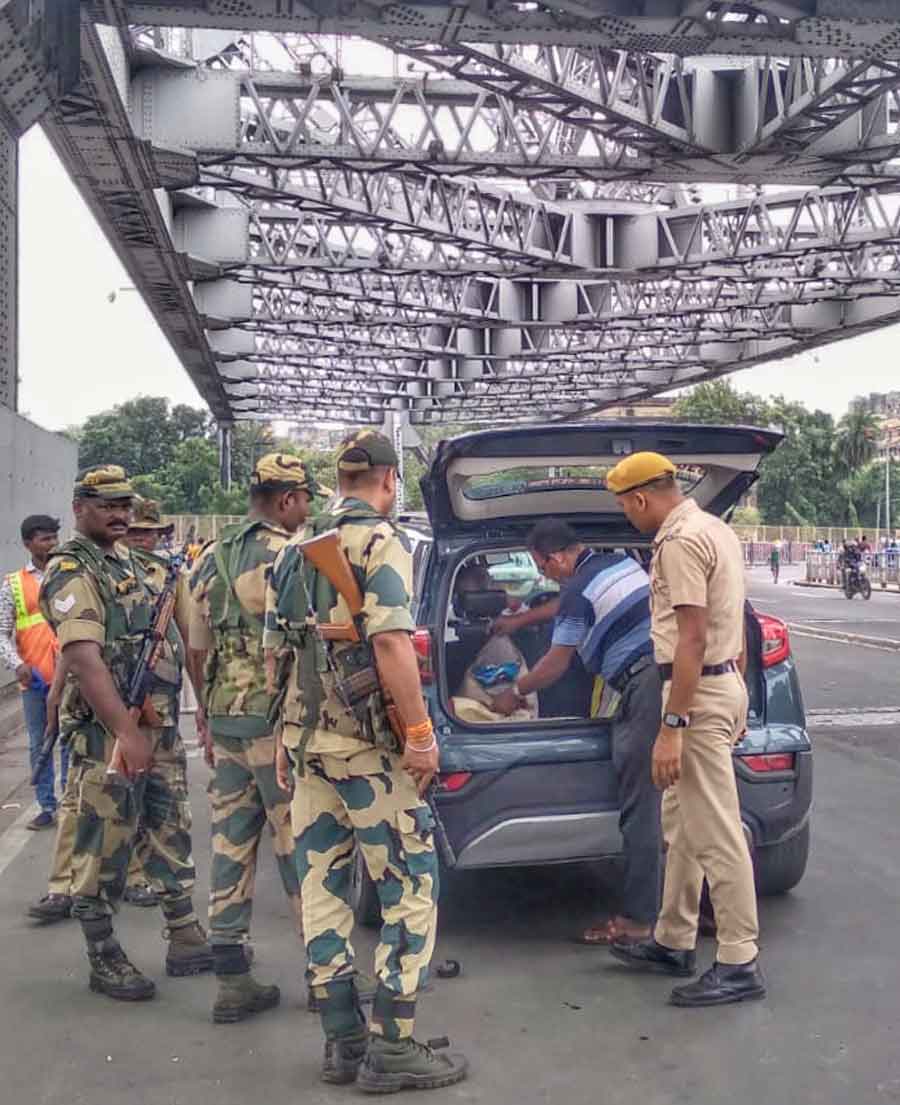 Naka check by central forces on Howrah Bridge during the general election in Kolkata on Saturday 