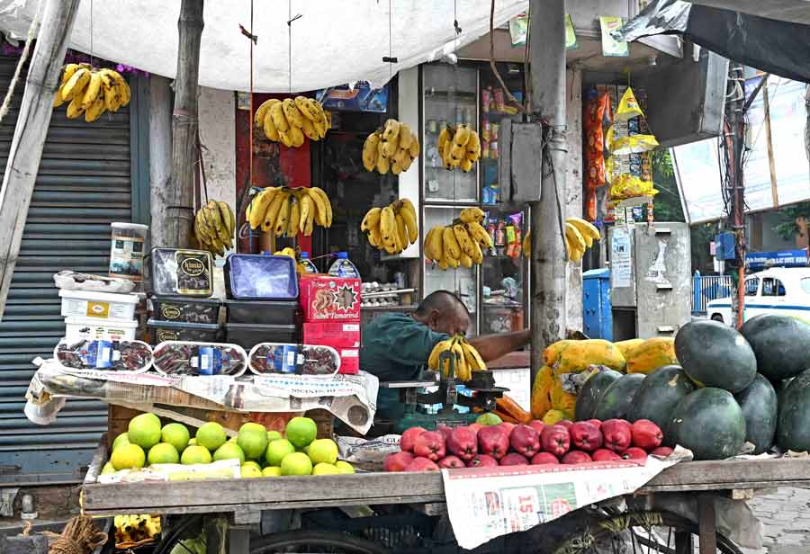 An empty fruit shop owner awaits customers near Esplanade on Saturday 