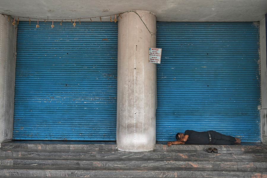 A man catches forty winks outside Esplanade Metro station