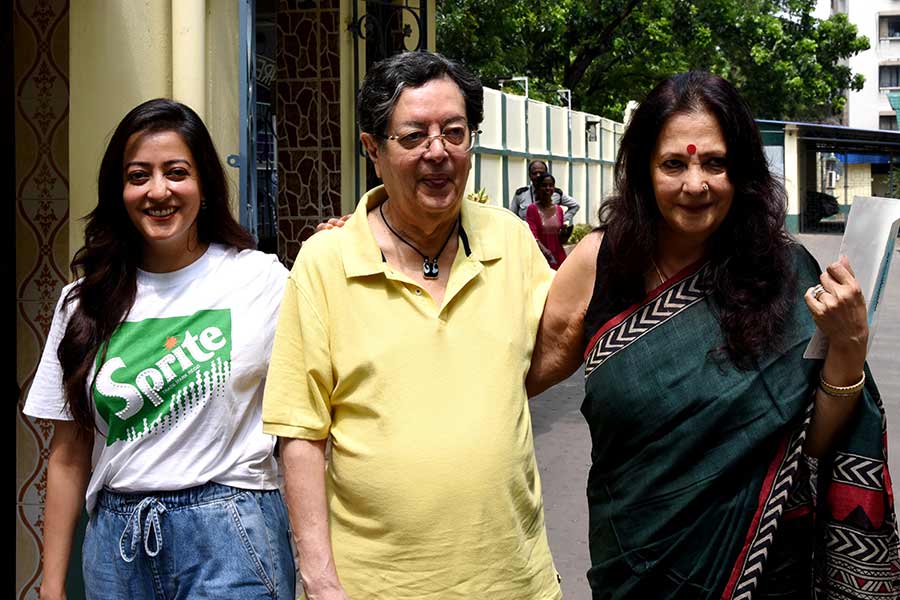 Actress Moon Moon Sen along with her husband Bharat Dev Burman and daughter Raima Sen step out of St Lawrence High School after casting their votes 