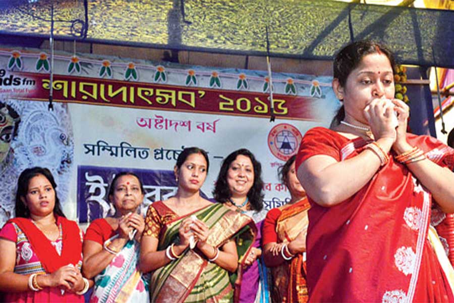 A conch shell-blowing contest during Durga Puja