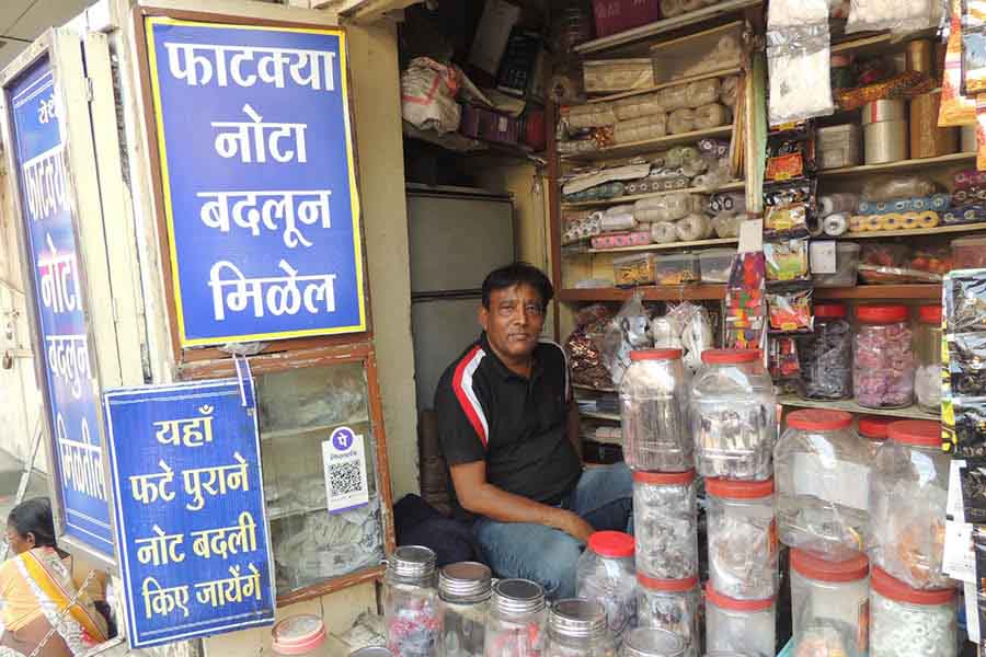 A currency exchanger who also sells eatables