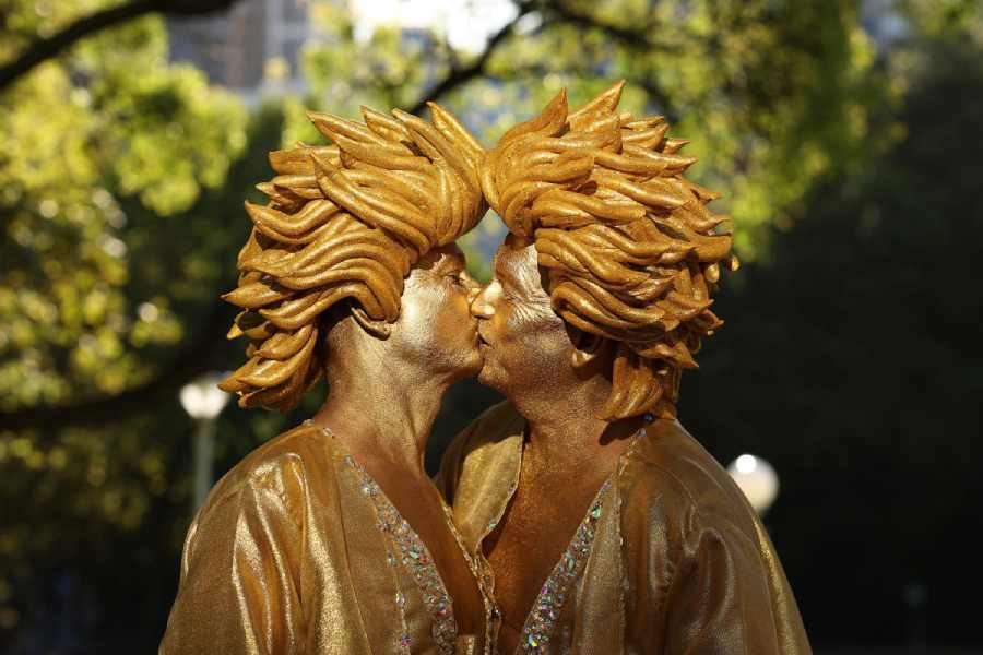 Parade goers kiss as they prepare ahead of the Sydney Gay & Lesbian Mardi Gras Parade as part of Sydney WorldPride on February 25, 2023 in Sydney, Australia. The Sydney Gay and Lesbian Mardi Gras parade returns to Oxford Street in celebration of the event's 45th anniversary. The parade began in 1978 as a march to commemorate the 1969 Stonewall Riots in New York and has been held every year since to promote awareness of gay, lesbian, bisexual and transgendered issues.