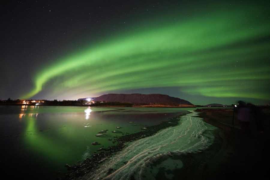 The northern lights over Ingolfsfjall mountain near Selfoss on the south coast of Iceland. Picture date: Monday November 28, 2022.