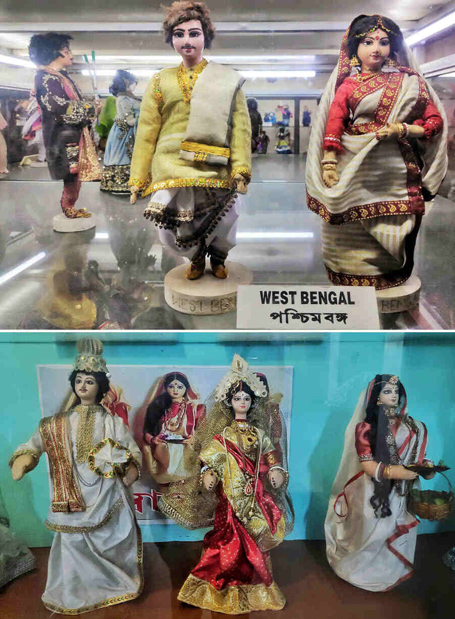 The dolls from West Bengal include a bride and groom in traditional wedding attire as well as a couple with the man dressed in a ‘panjabi’ and traditional ‘kochano dhuti’ and the woman in a white and red sari draped in the Bengali style. The traditional garments are in silk and cotton embellished with intricate motifs and patterns
