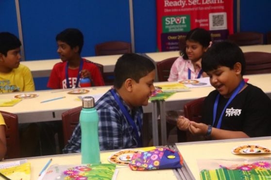 The young participants were happily engrossed in learning how to build their working models. 